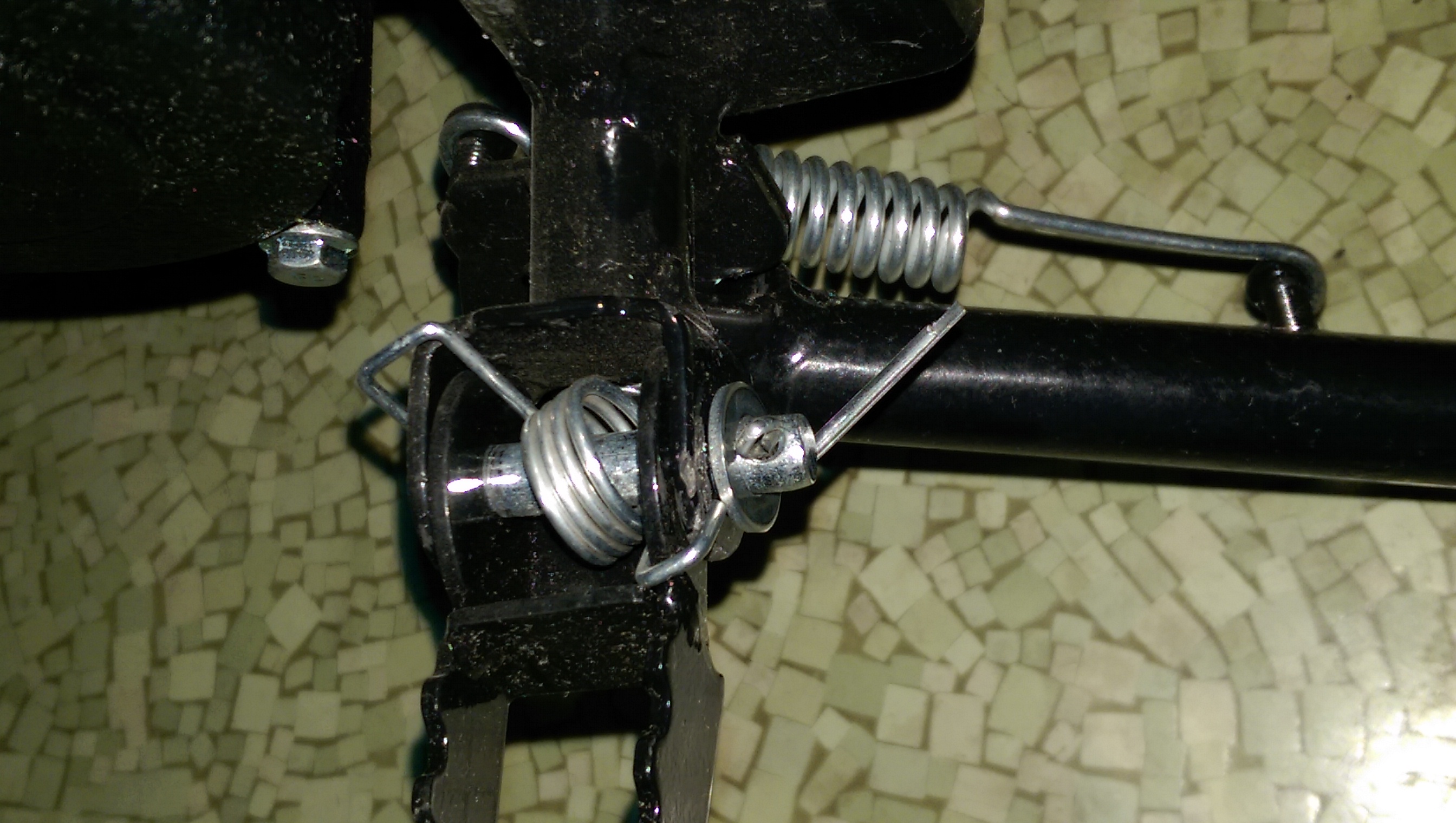 This is a picture of the footpeg spring on the wrong way. I have more pics as well...