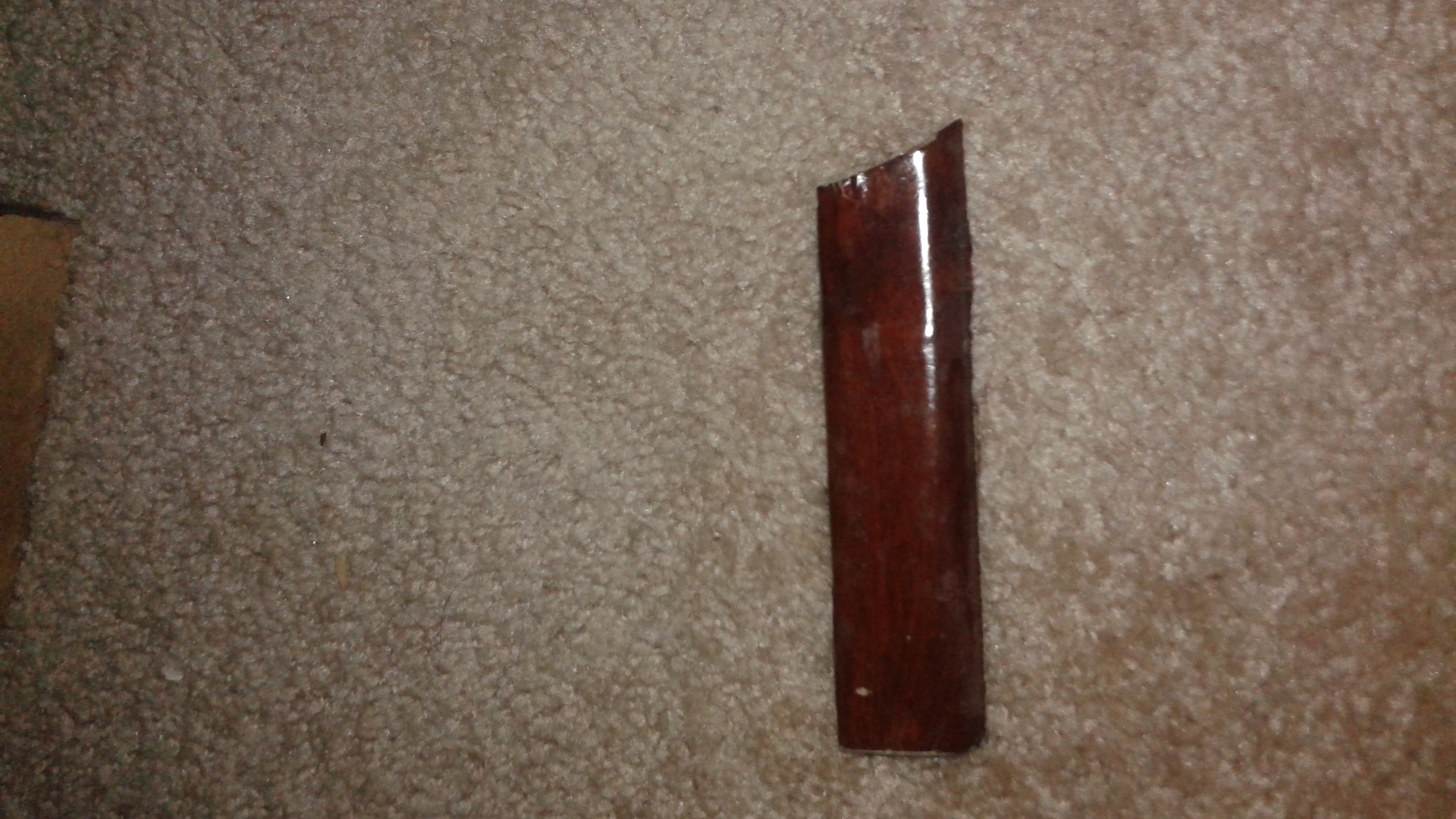 Piece of wood broken from nightstand