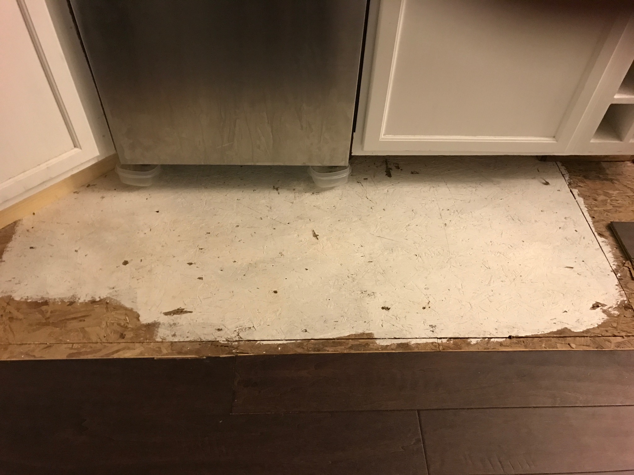 Damages from the water after the cabinets were re-installed.  Waiting on the floor to be fixed.  Still leaking!