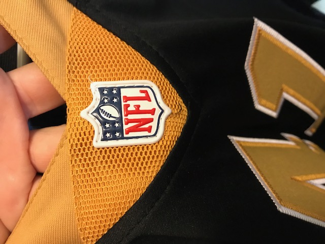 NFL logo is plastic, not embroidered fabric
