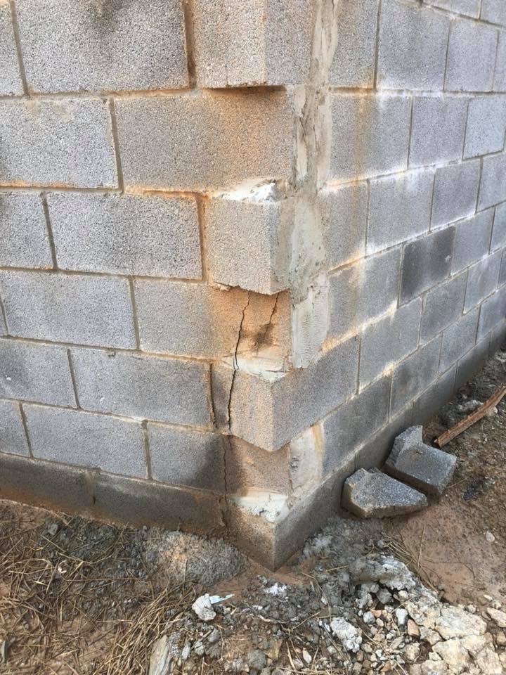 bottom of retaining wall is cracked 