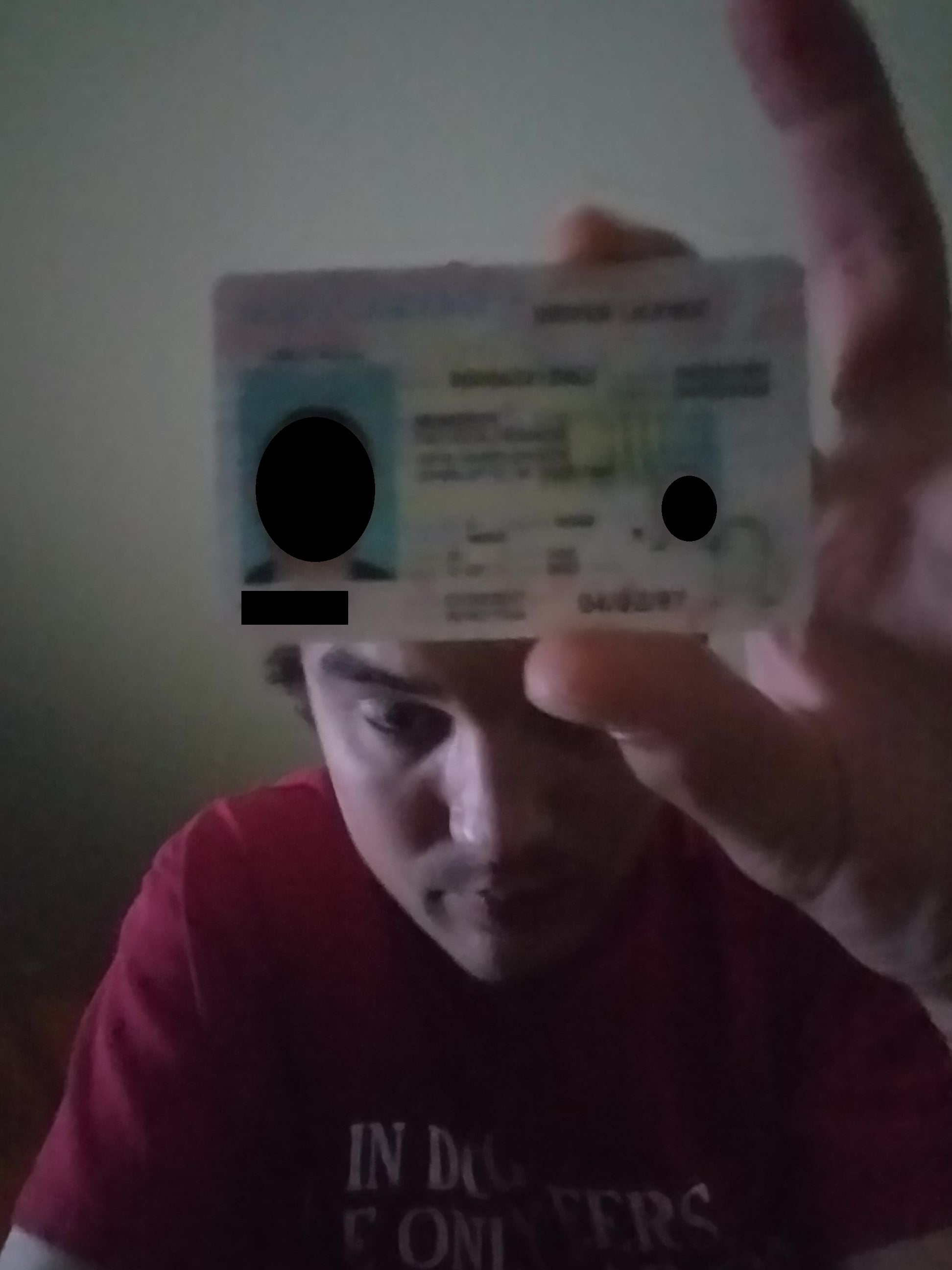 picture of Patrick murphy holding ID when buying