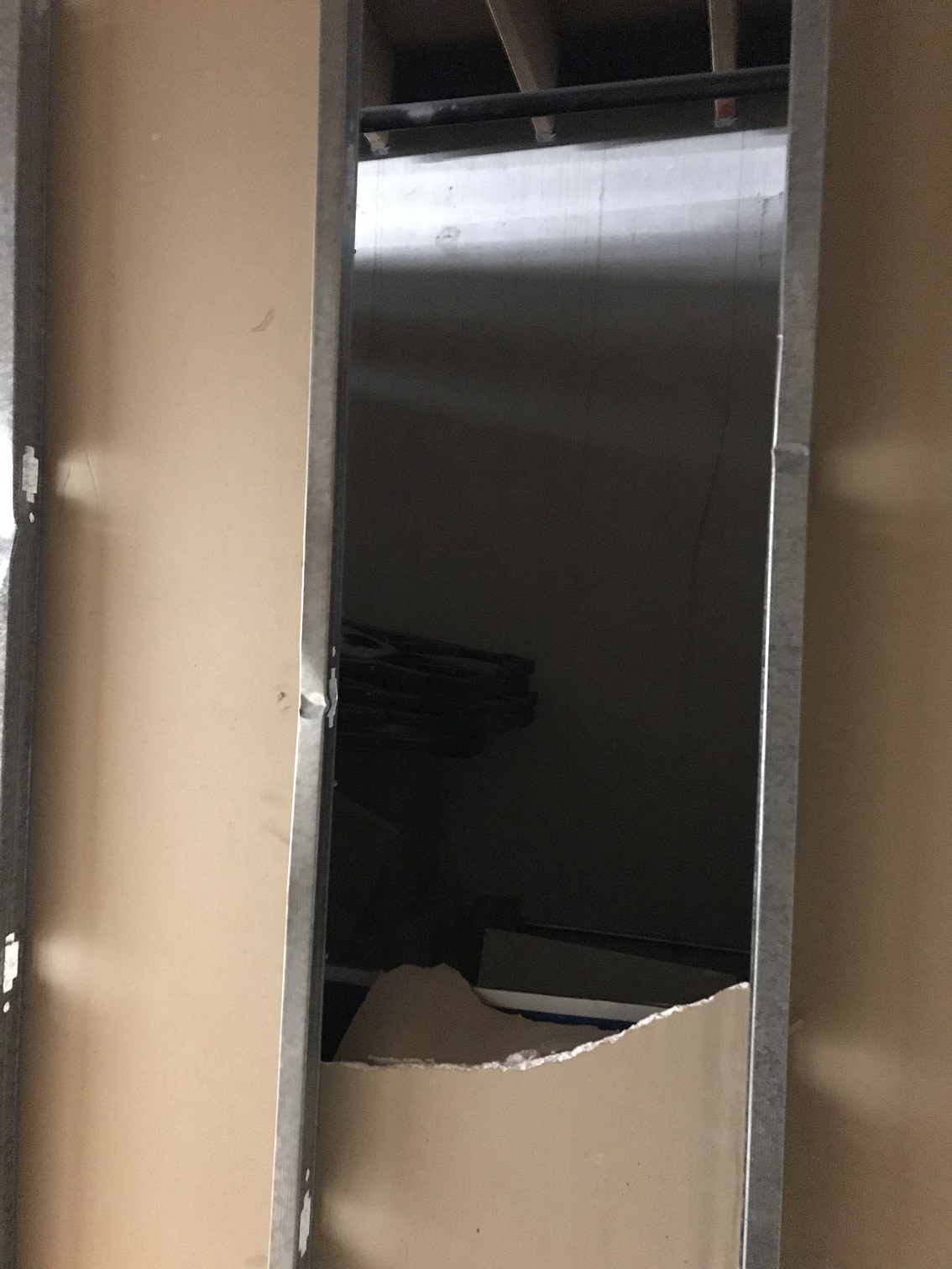 Hole in my storage unit, looking into other unit.