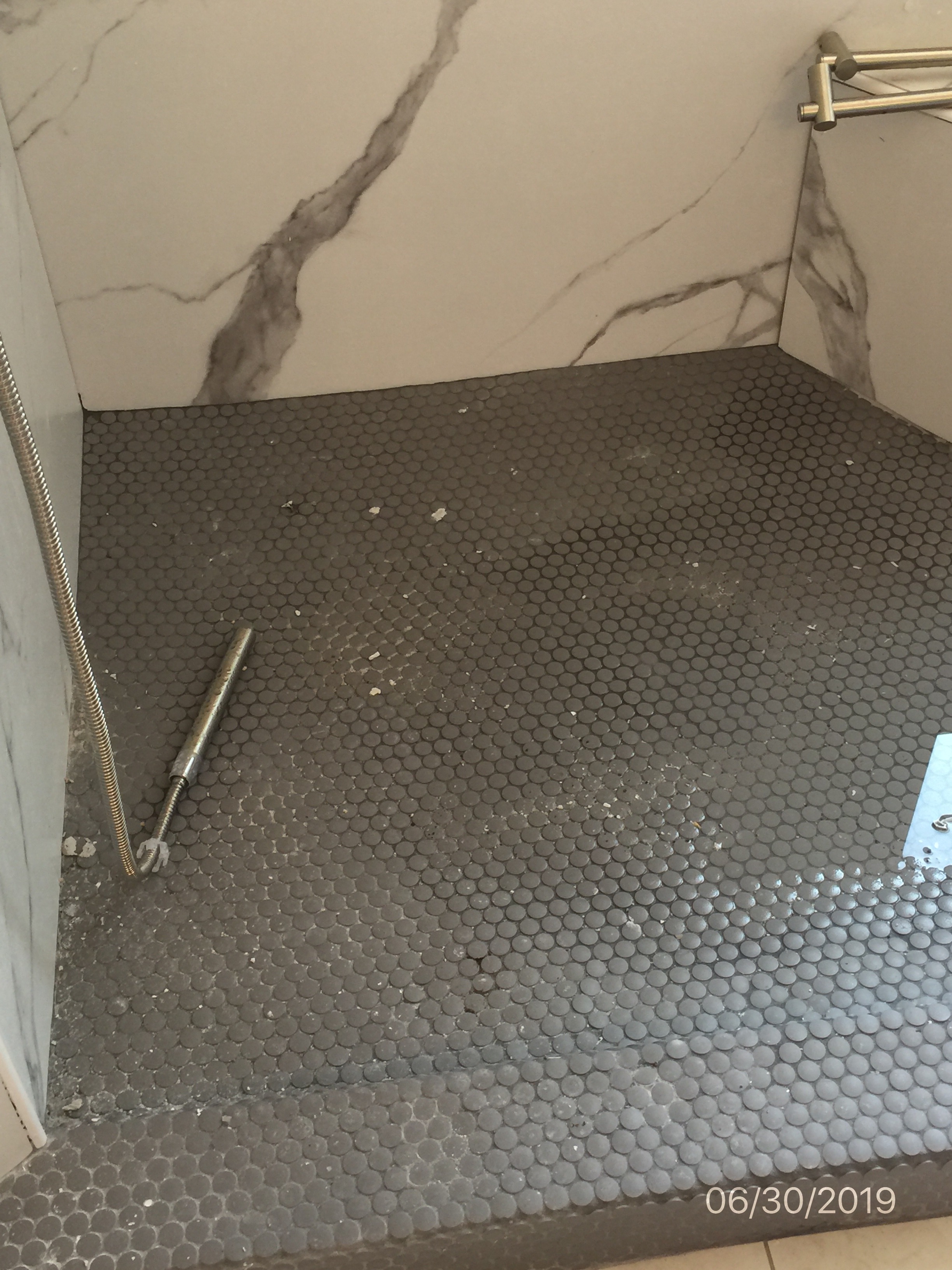 shower floor not level and doesn't drain