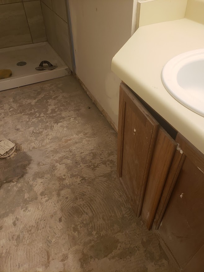 MISSING FLOORING AND TOILET AND GROUT