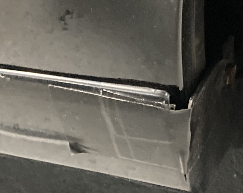 broken sideboard held with tape