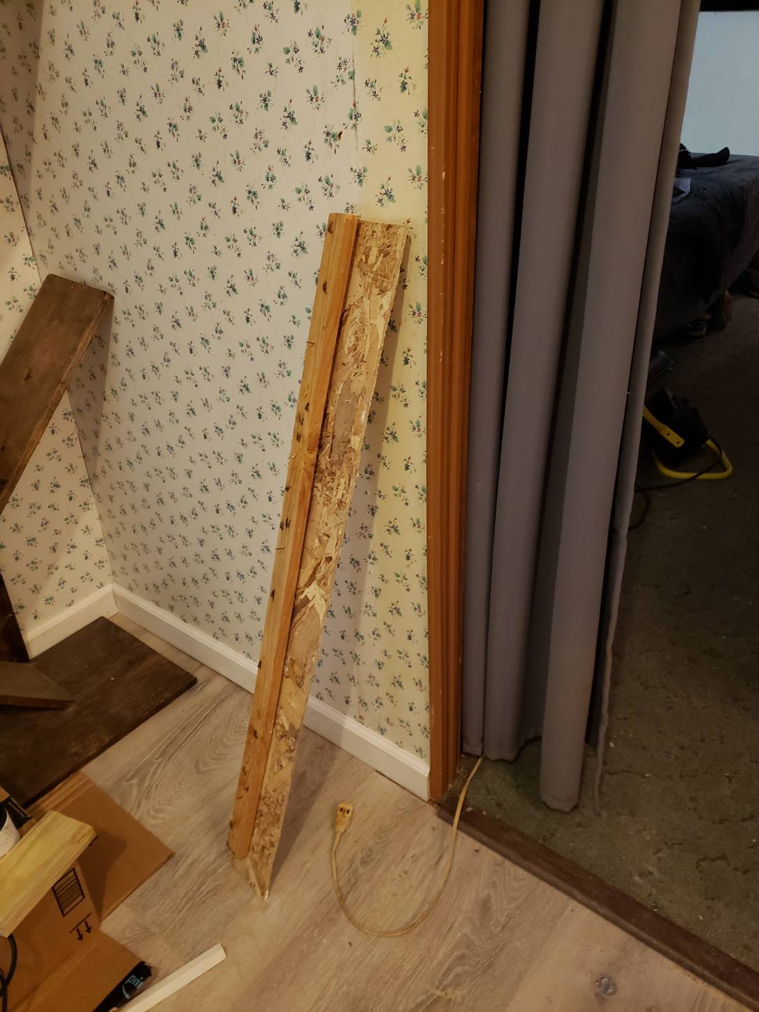Random wood used to fill wall supporting shower