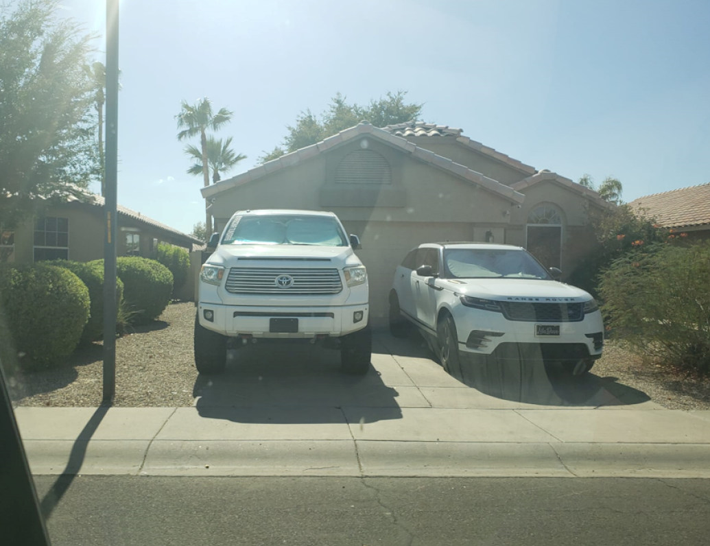 On low income housing but own two expensive cars