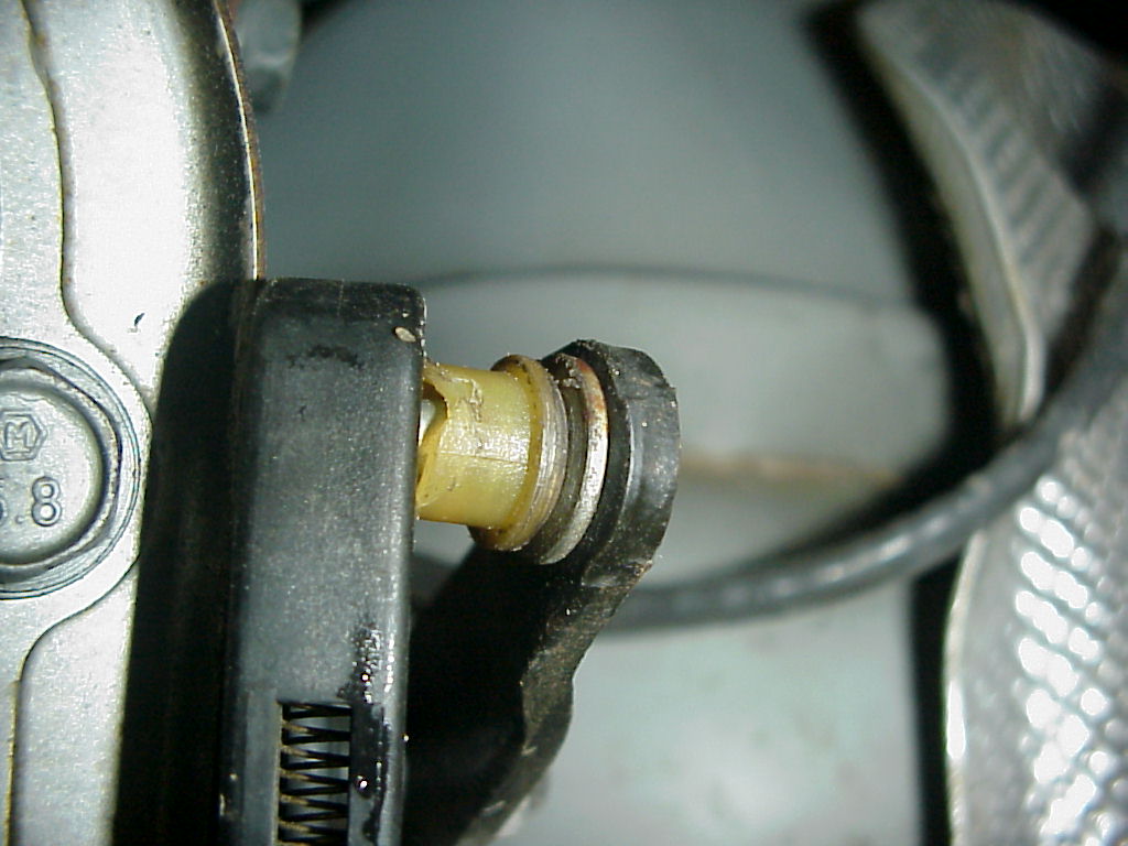 photo of worn out bushing thatt is suppose to be press into the cable end.