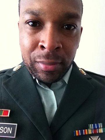 Put on his fiance's military uniform to pose like he is in the military. He is not.