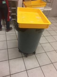 Food for customers on full garbage can 