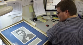 Senior writer Mike Nelson cataloging an authentic Abraham Lincoln signature