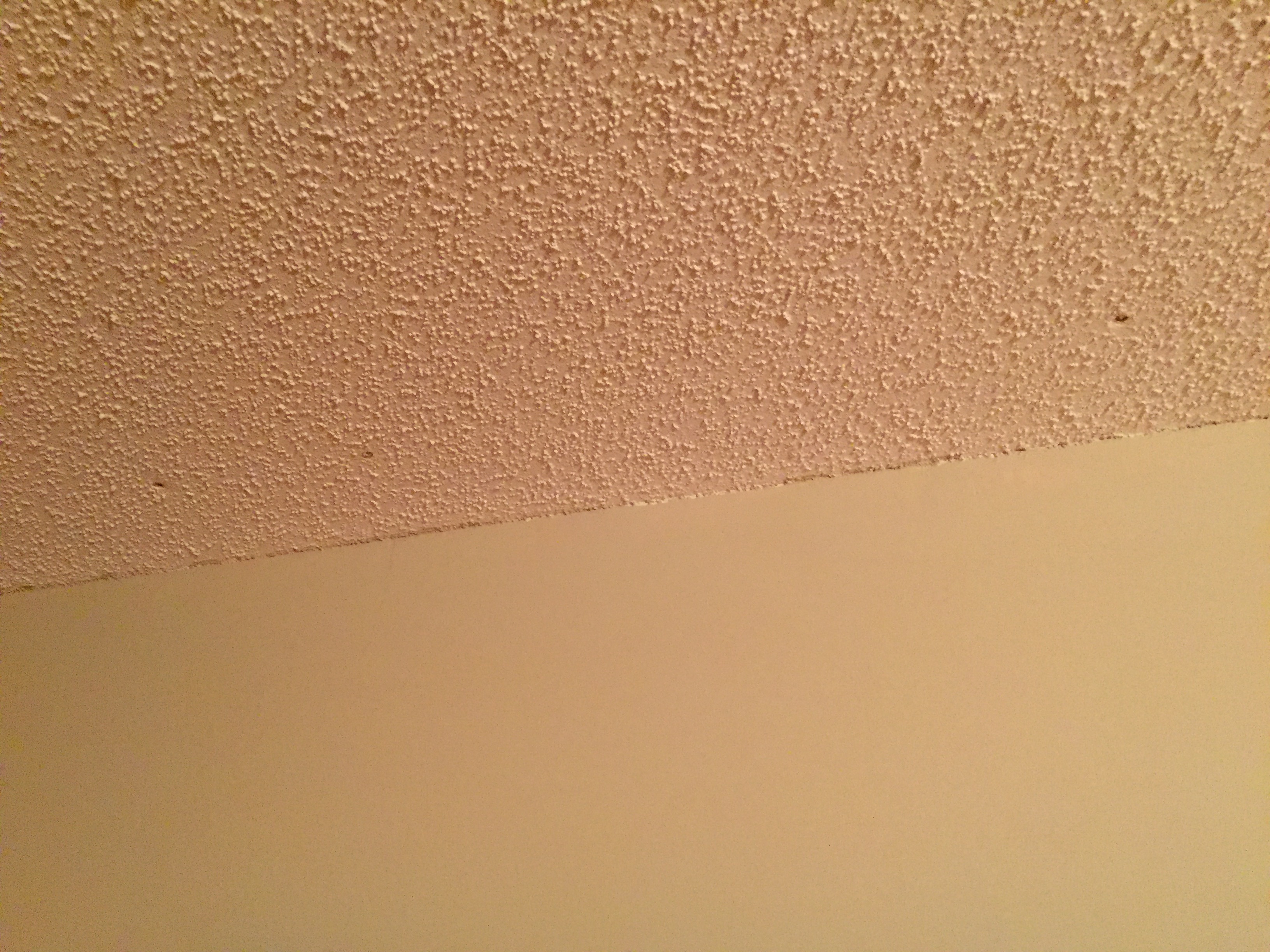 Nails popping out of living room ceiling