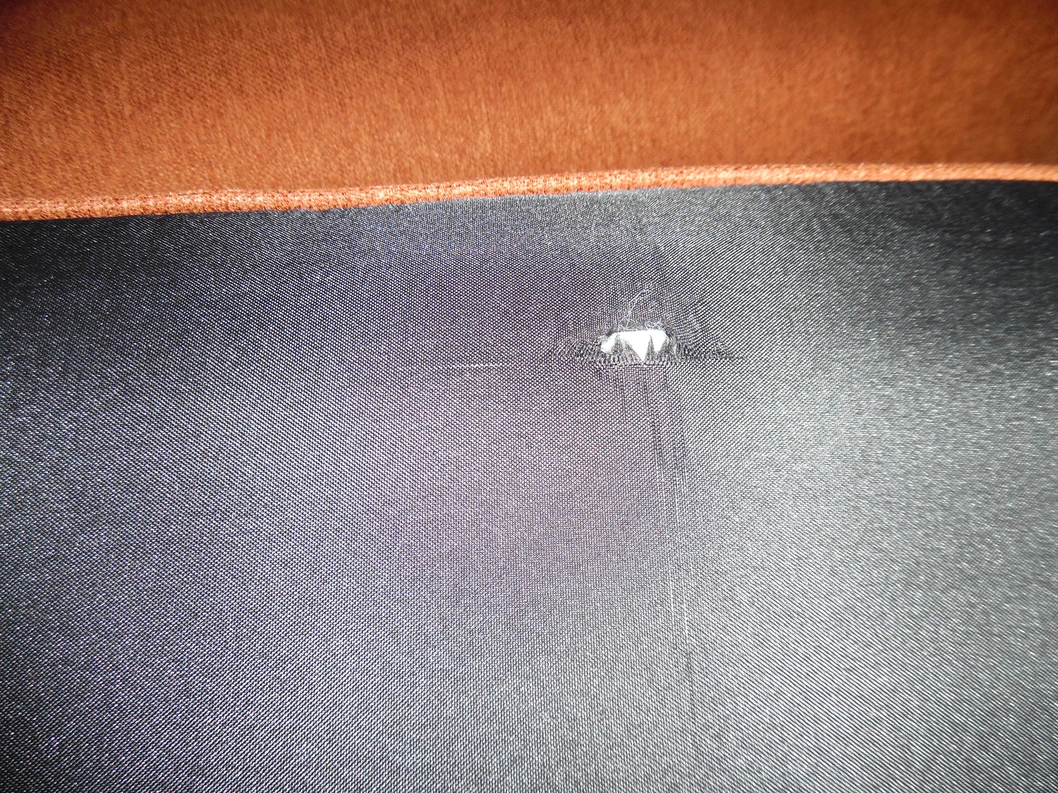 Defect at bottom of the cushion, out of the box
