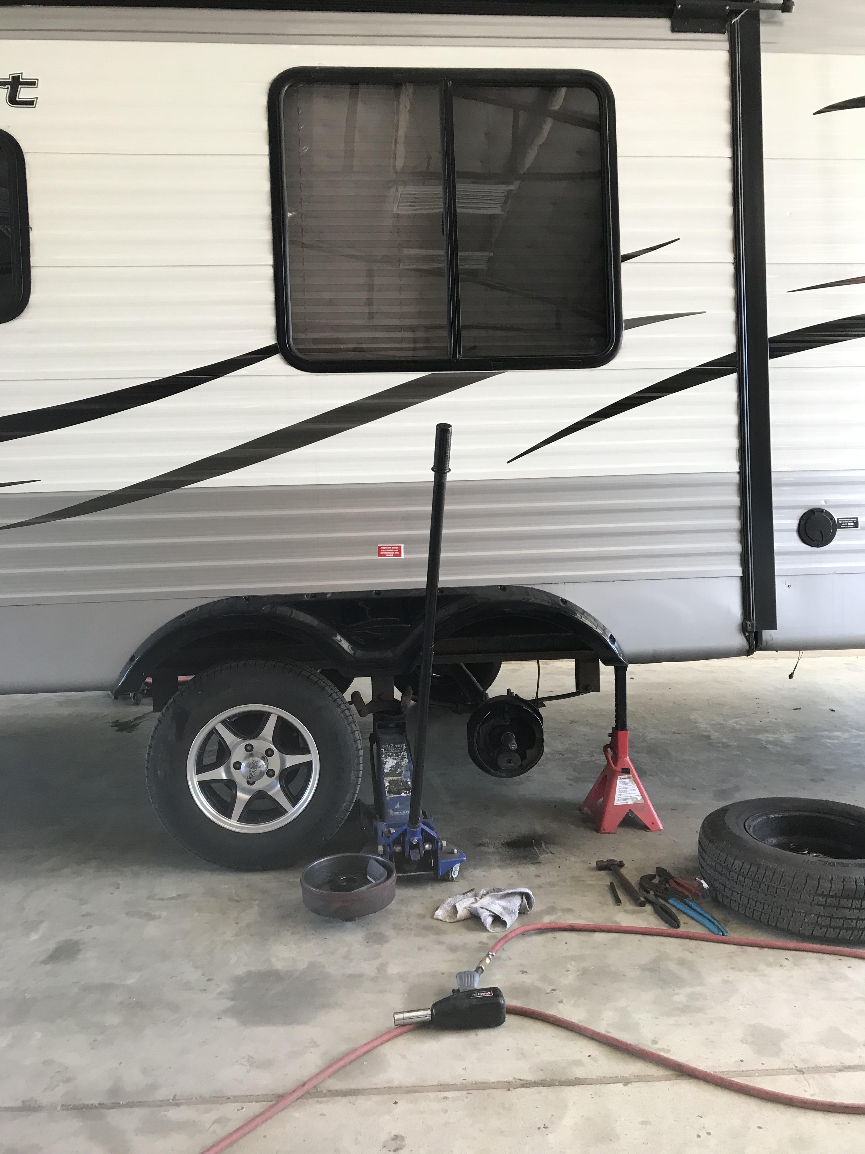 In the RV shop one tire off