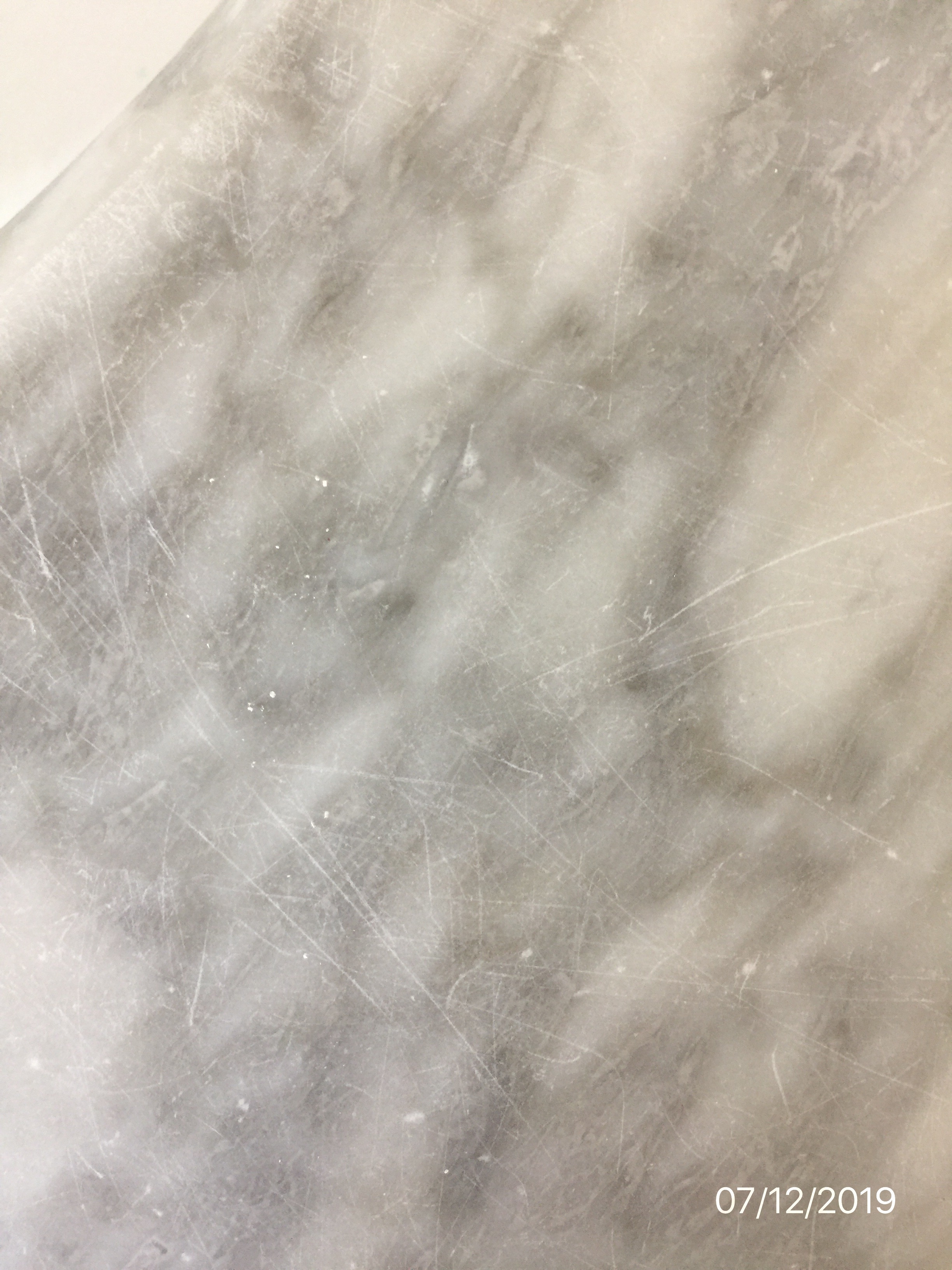 scratched our marble vanity top