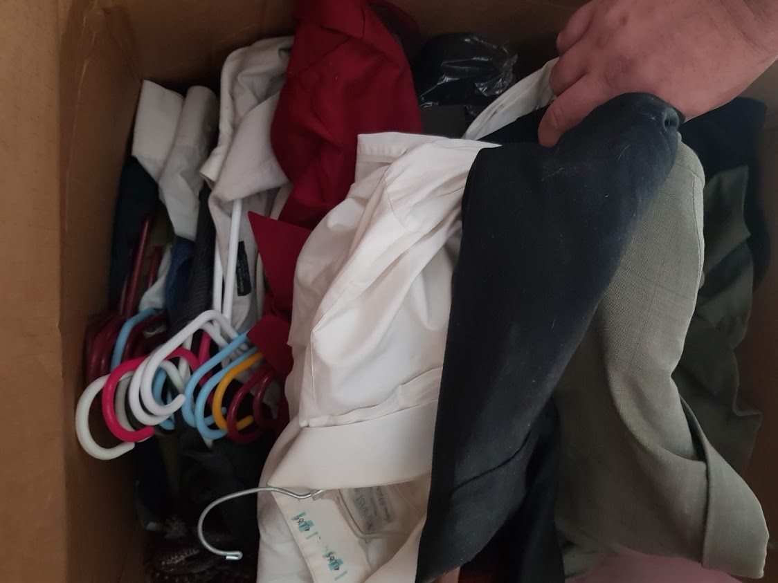 suits thrown in a box