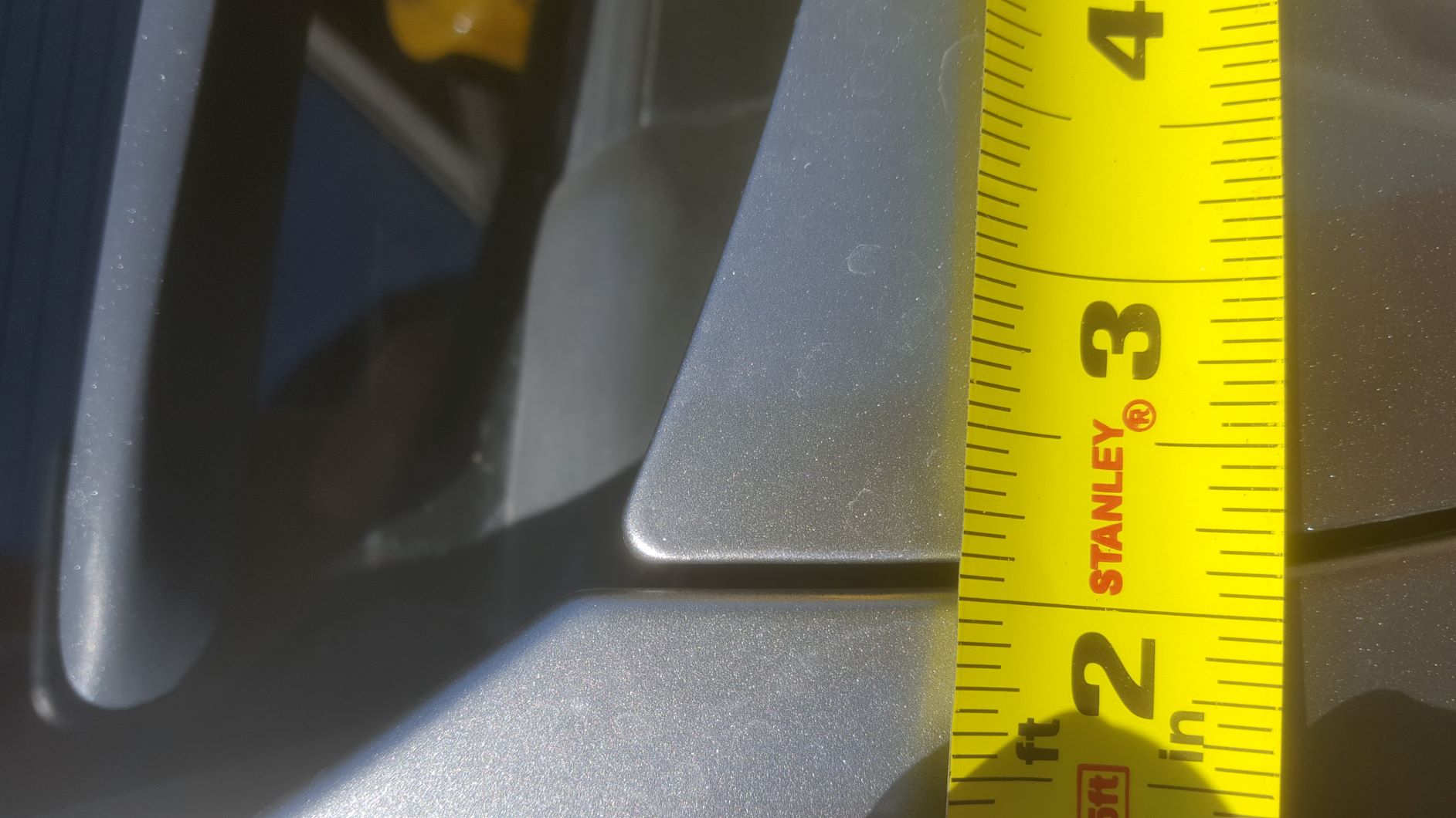 Panel gap on right side of hood near hinge