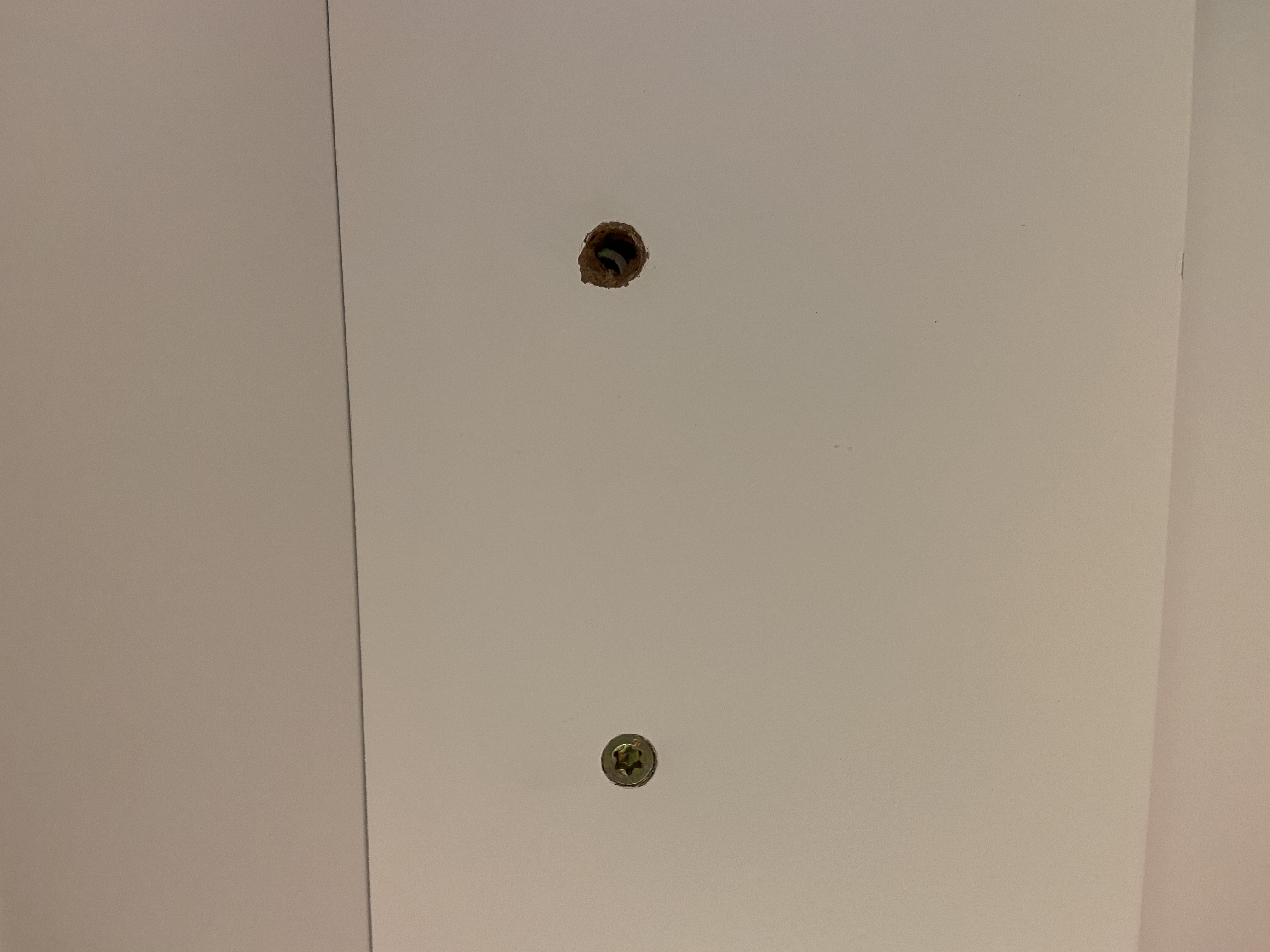 Extra hole in medicine cabinet