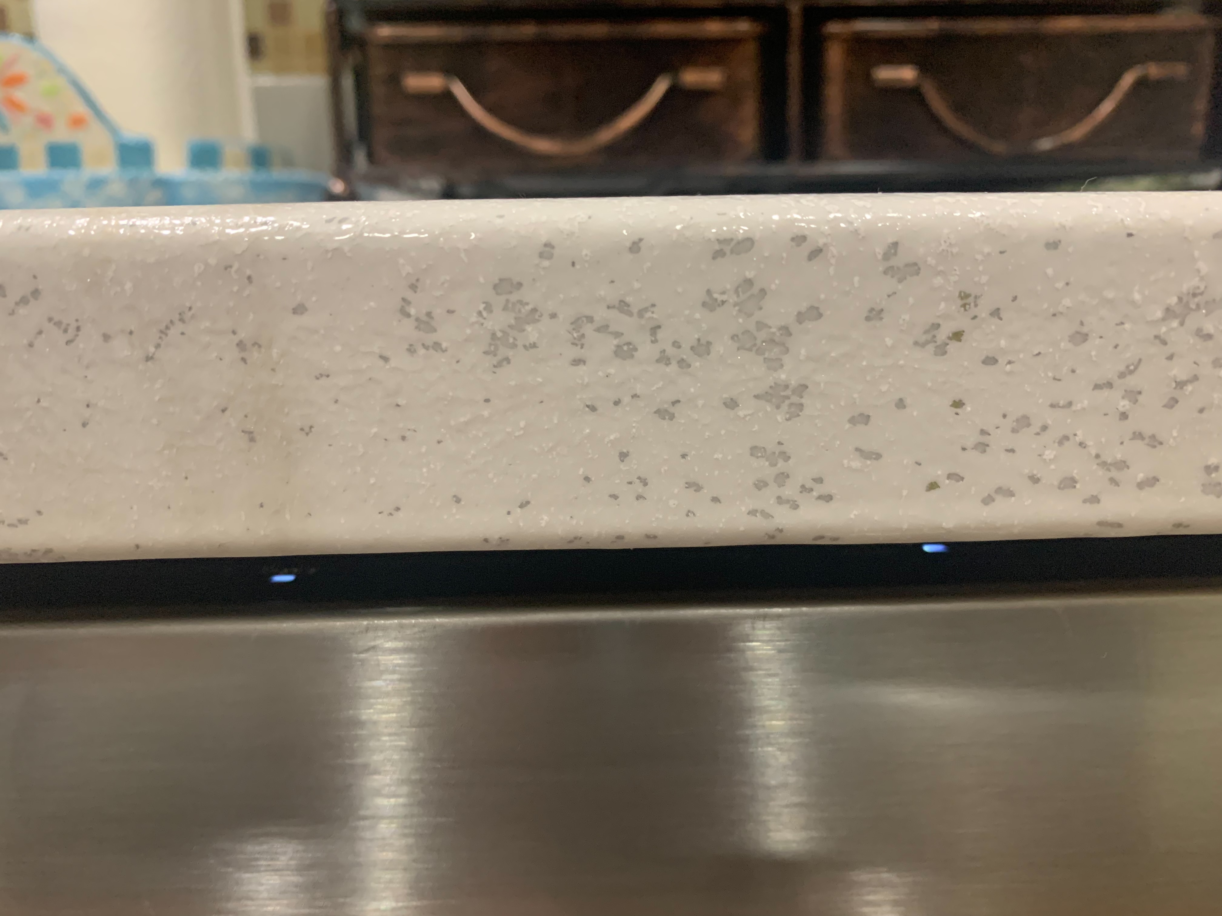 pitting & ugliness all around the counter top edge