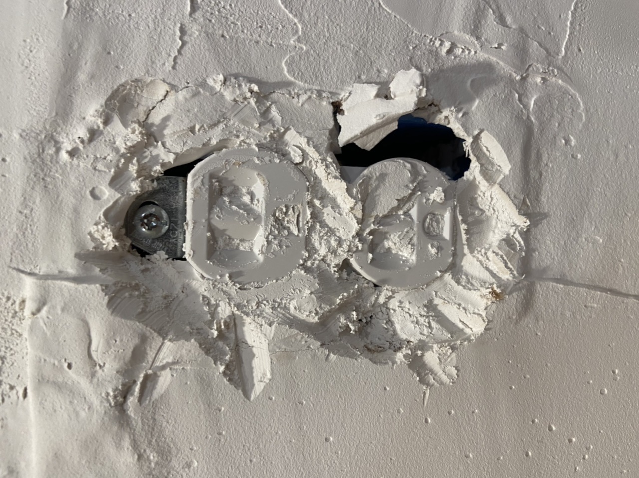Tried to buried the outlet with drywall mud