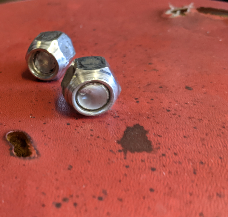 I had to break the studs to get the lug nuts off