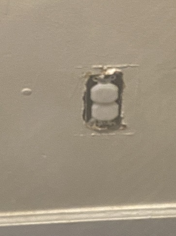 	Exposed wall outlet wiring