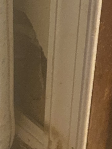 	hole in wall by bathroom