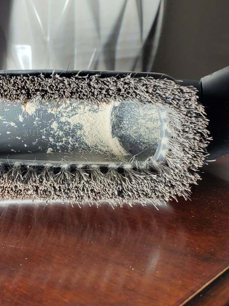 Fiberglass dust from HEPA vacuuming wall