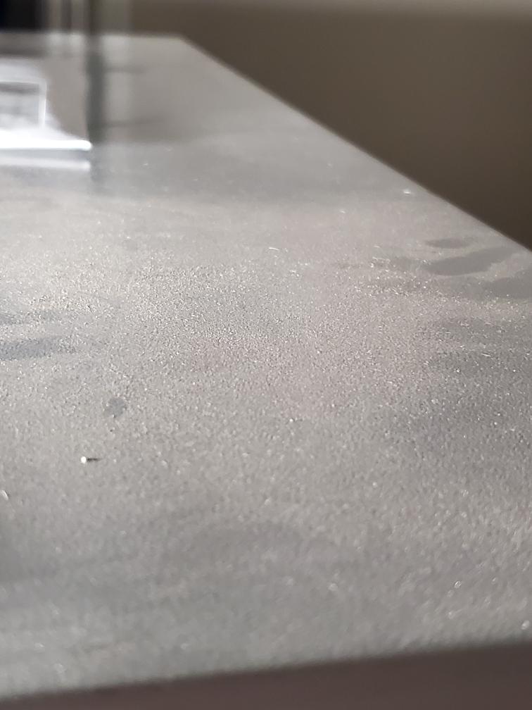 Fiberglass dust on filing cabinet