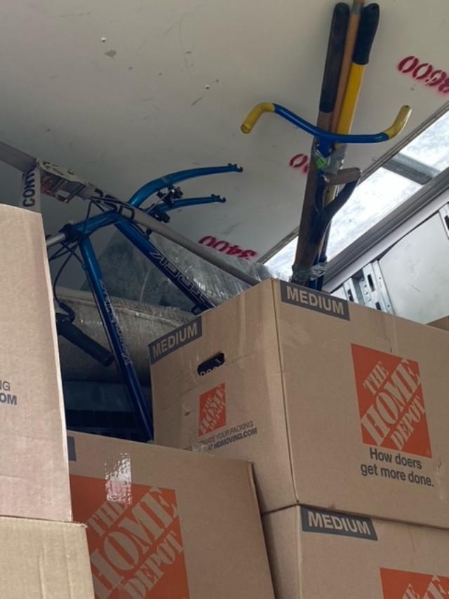 My bike broken and shoved on top of boxes